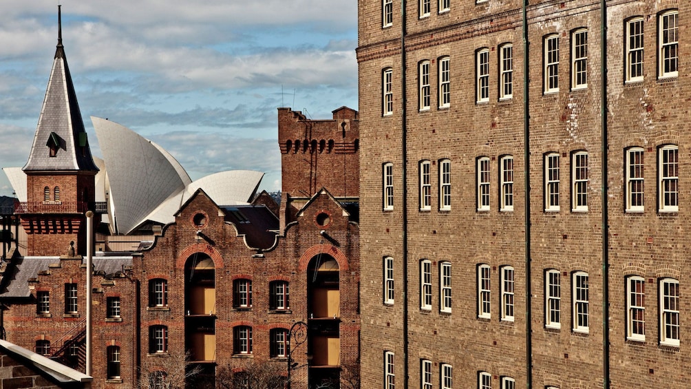 Shot of old brick buildings with the Sydney Opera House in the background