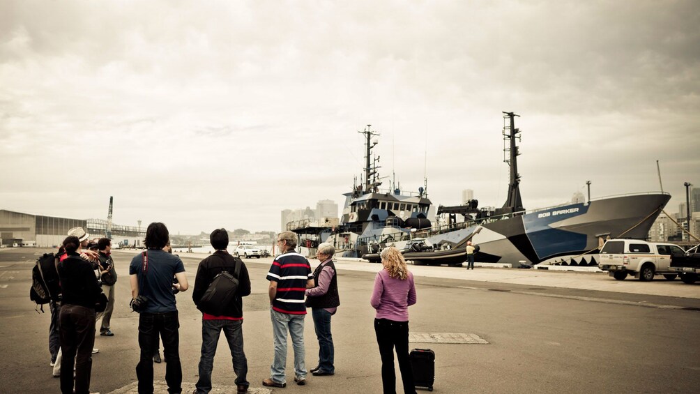 Group of photographers looking at the Anti-Whaling ship Bob Barker