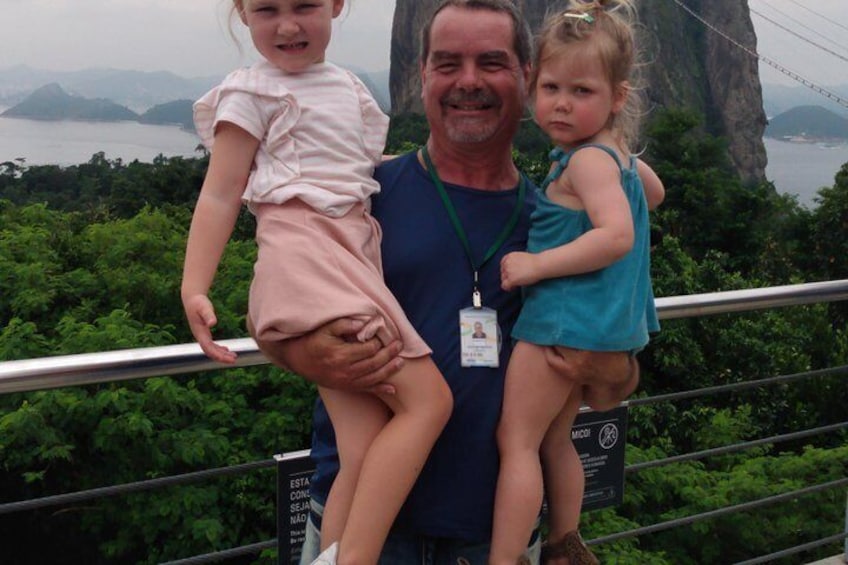 Cute kids from Belgium with Sugar Loaf behind.