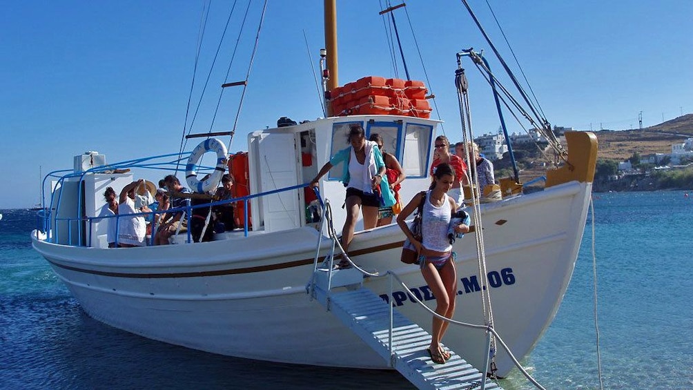 Tour group disembarking a sailboat on Mykonos