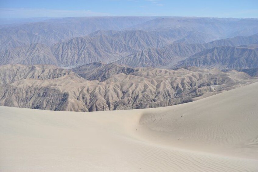 Sandboarding in the biggest dune of the world Cerro Blanco