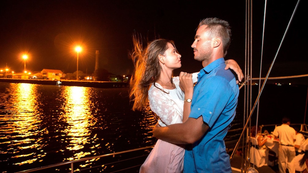 Tampilkan item 1 dari 5. Couple dancing aboard a boat on a night cruise of Bali Hai
