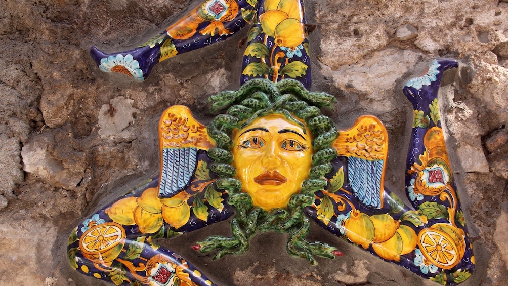 Symbol of Sicily in typical Sicilian glazed ceramic in Taormina