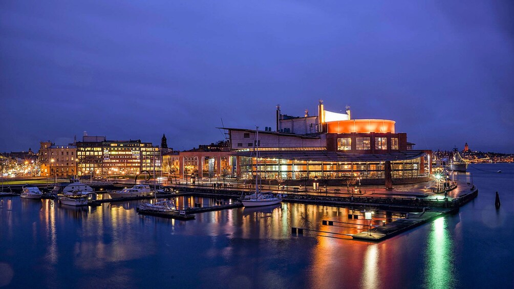 Show item 4 of 5. Lit Gothenburg bay at night in Sweden