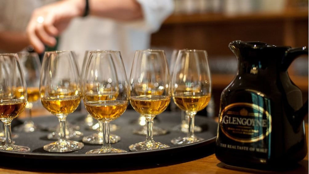 Glasses of whiskey on a tray in Edinburgh.