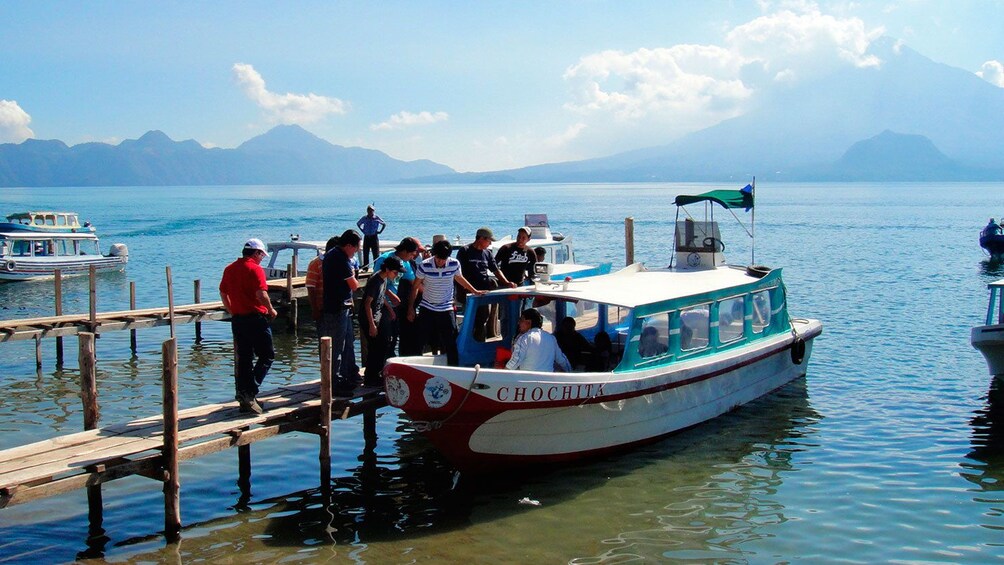 People boarding boat on Lake Atitlan