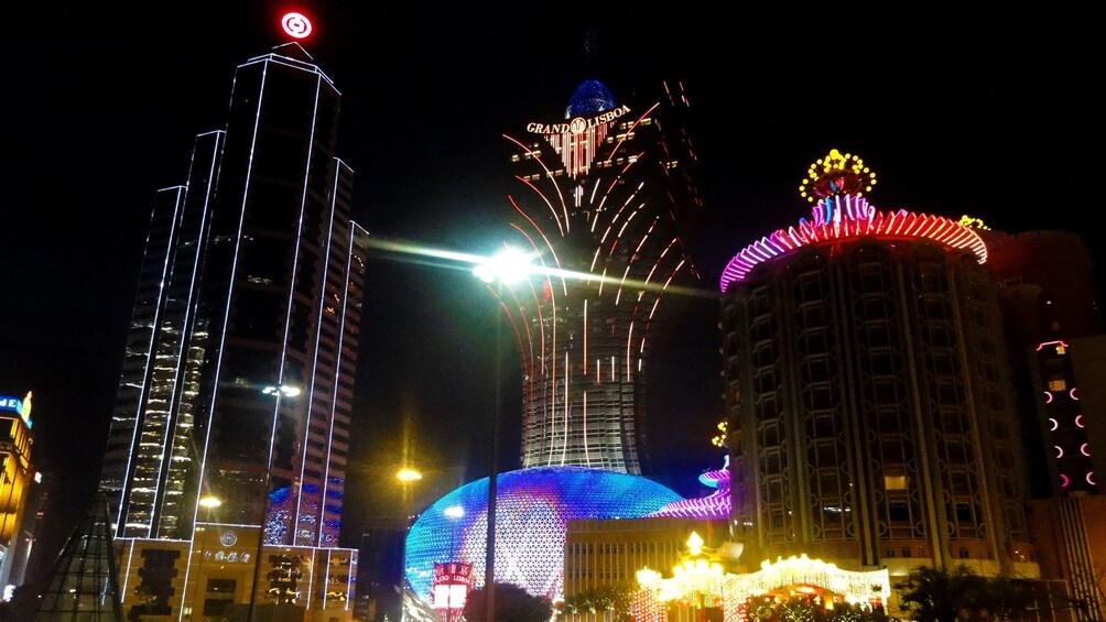Show item 2 of 5. Neon lit skyscrapers in Macau at Night.