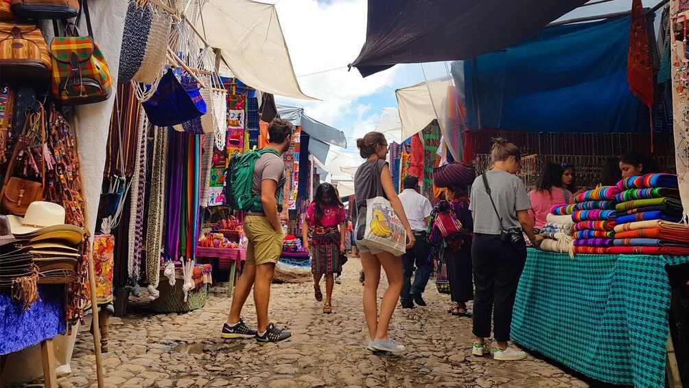 People looking at vendors in Chichicastenango market in Guatemala