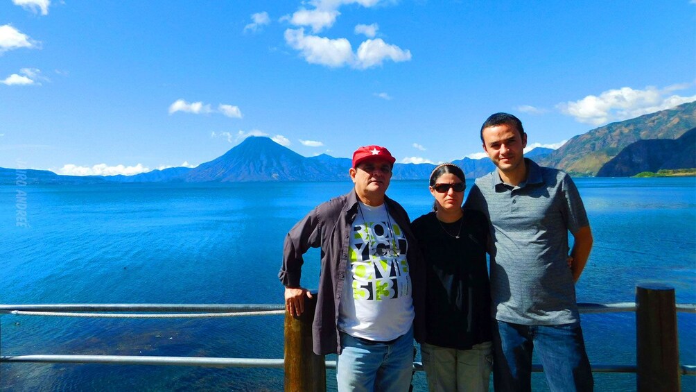 Family has picture taken in front of Lake Atitlan