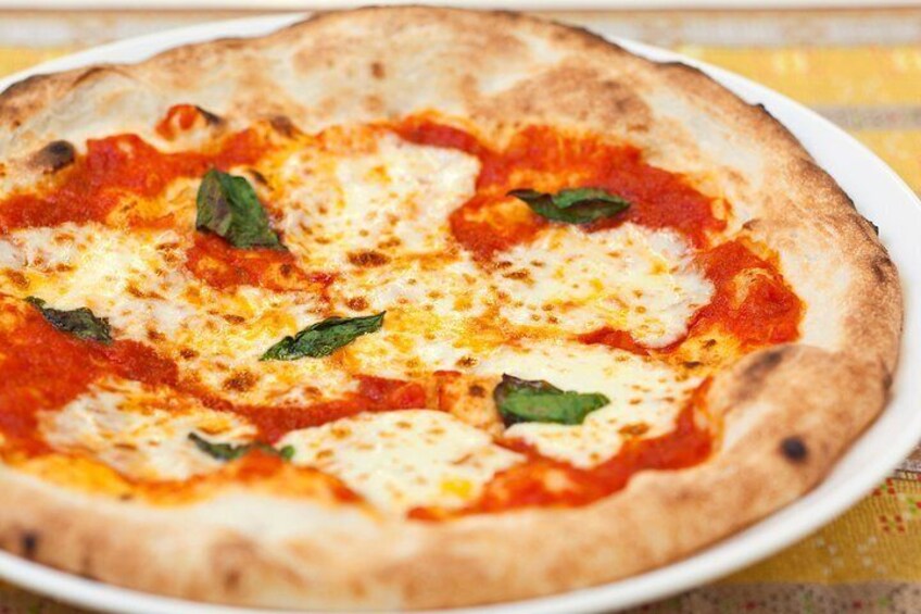 “Margherita” is baked at once in a full-scale pizza oven at 500 degrees and finished with a mochi-mochi texture.