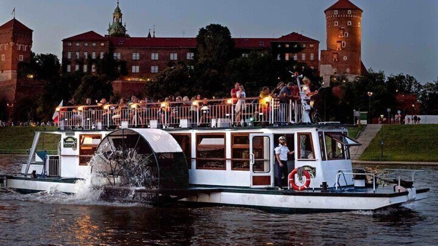 Side-wheeled ship - Legenda Boat against the background of the Wawel castle in Krakow
