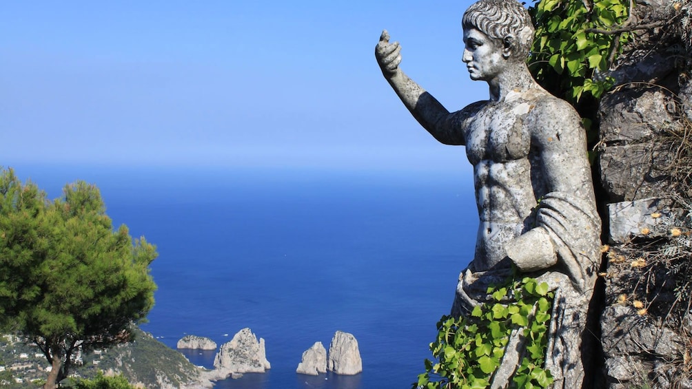 Ancient statue in cliffside of Capri Island
