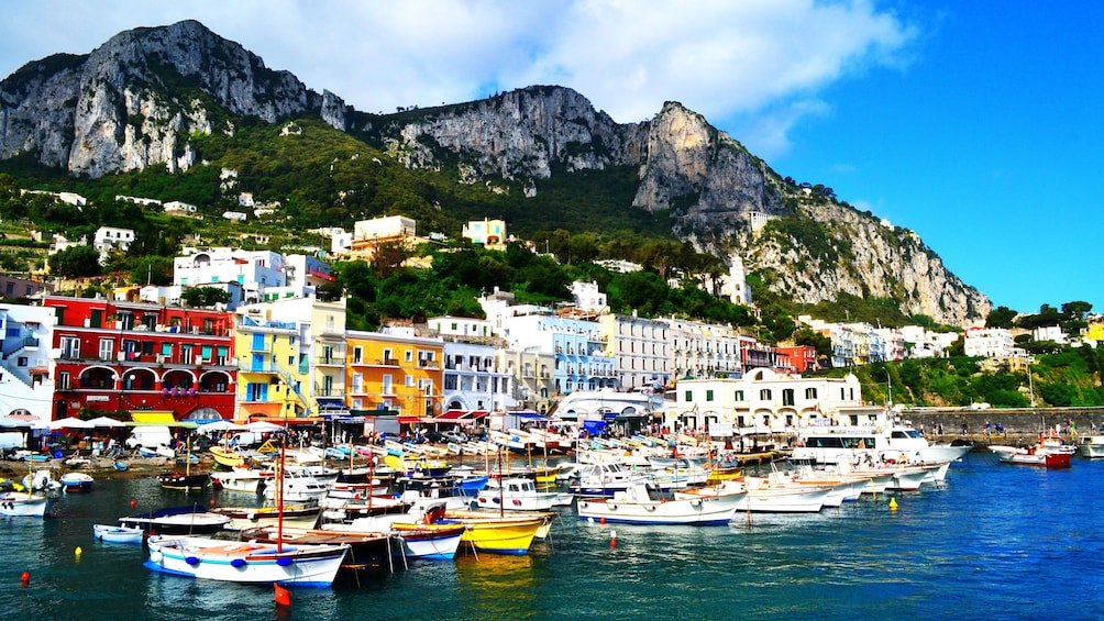 Boats moored in city on Capri island 