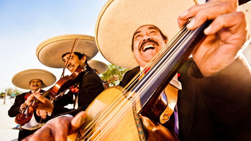 A mexican band performing in a park