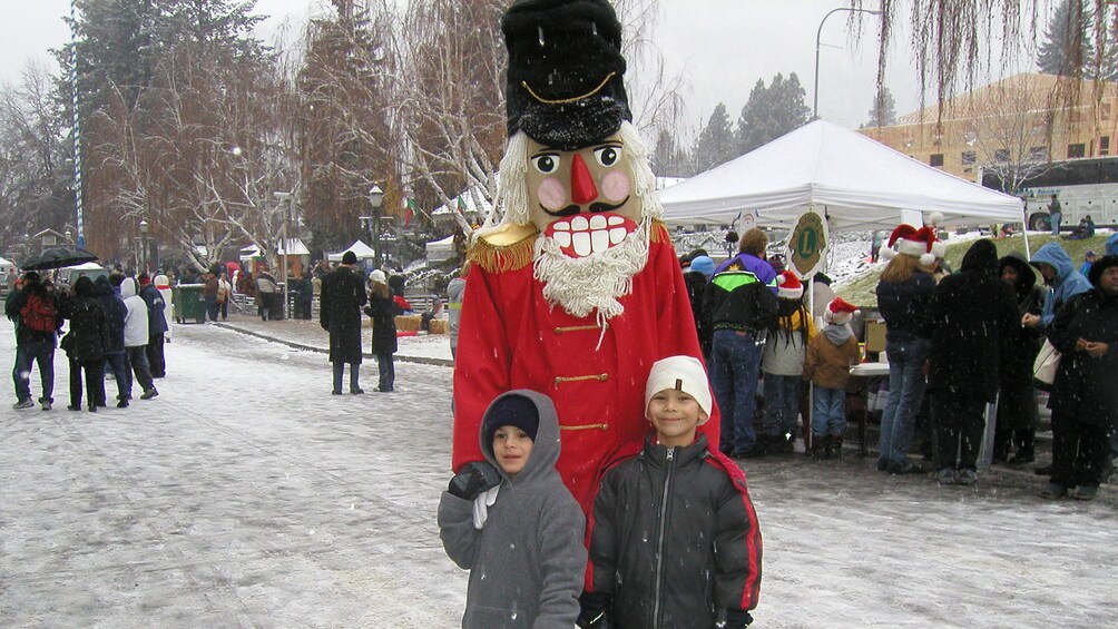 Children with nutcracker in snow