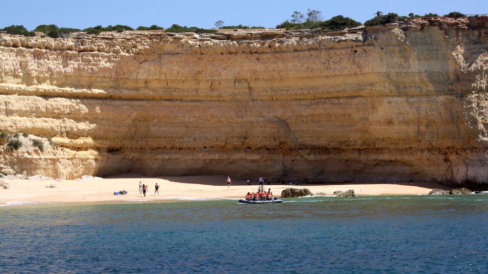 Tour group on a small secluded beach in Algarve