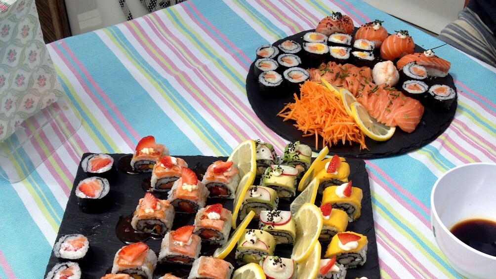 Plates of sushi on a sailboat in Lisbon