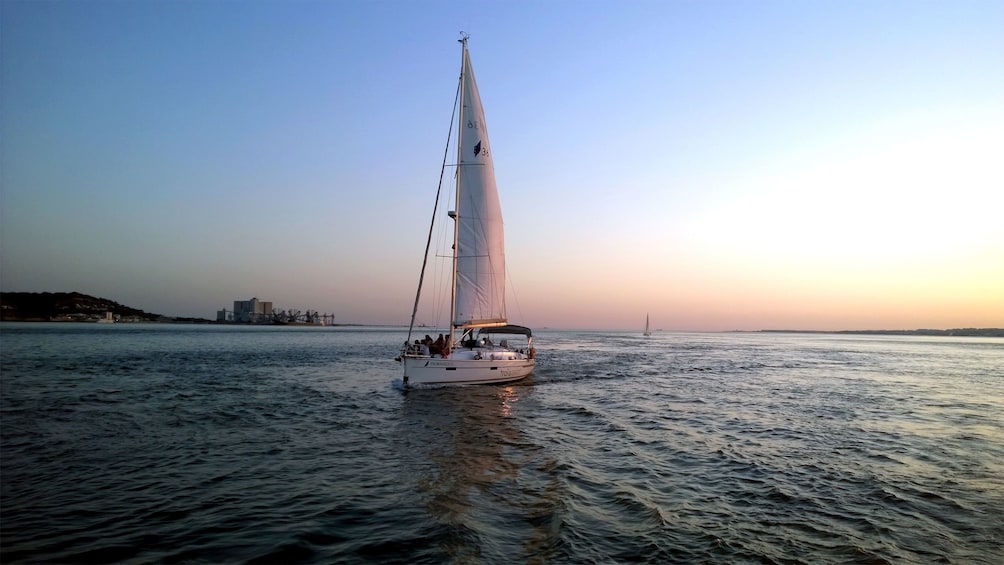 Sailboat at sunset in Lisbon