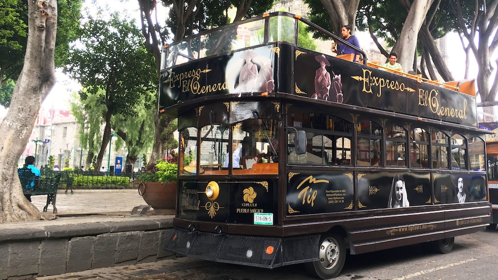 Double decker tour bus parked at attraction in Puebla
