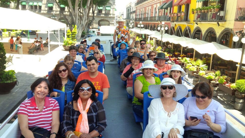 Tourists on double decker tour bus in Puebla