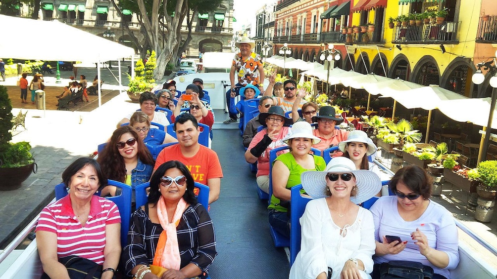 Tour group in double decker tour bus in Puebla