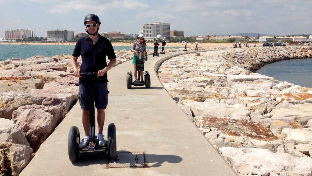 Charger l’élément 1 sur 5. People on segways on a jetty in Algarve