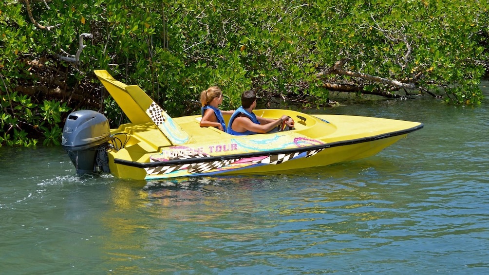 Speedboating in the jungle waters of Mexico