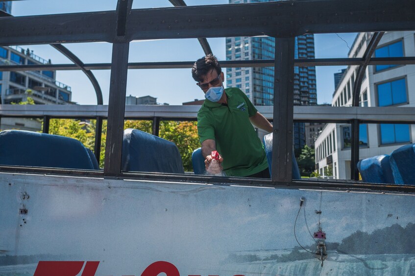 Cleaning the interior of Hop-On Hop-Off bus in Vancouver