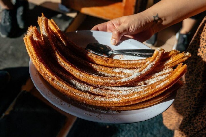 Try the classics: churros & tacos in your private tour
