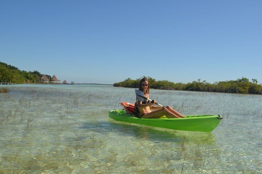 Kayak around the beautiful mangrove surroundings of Bacalar Seven Color Lagoon 