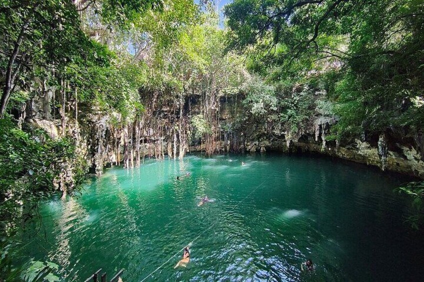 Chichen Itza and cenote in a mayan community