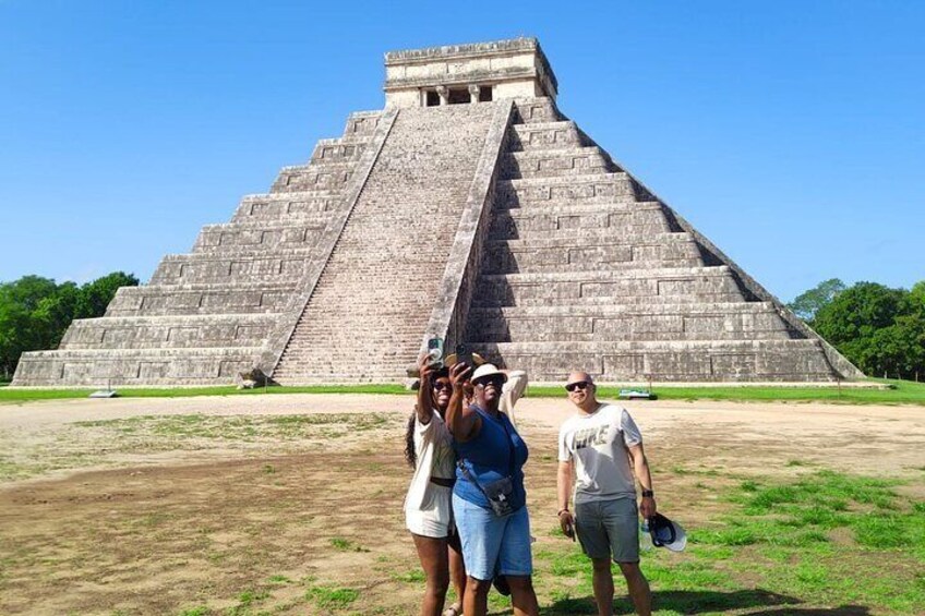 Chichen Itza and cenote in a mayan community