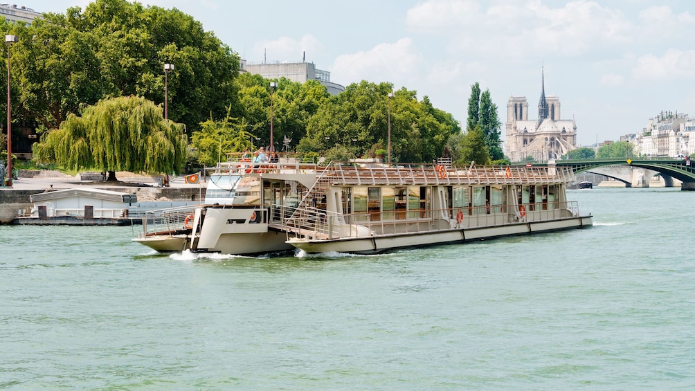 River boat sailing down the Seine river in Paris