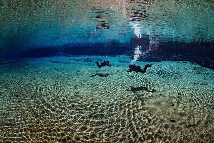 Divers in the Silfra Lagoon