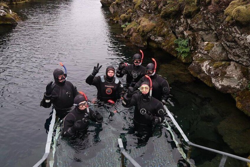 snorkelers entering Silfra