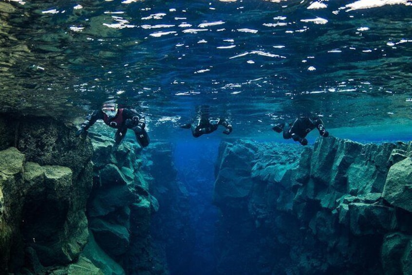 Snorkelers on top of Silfra fissure