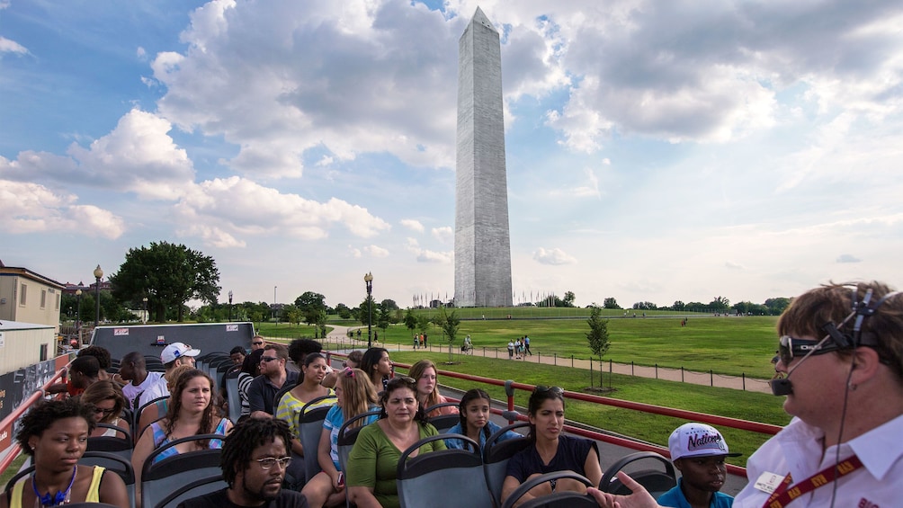Upper level of a tour bus with the Washington Monument in the background in Washington DC