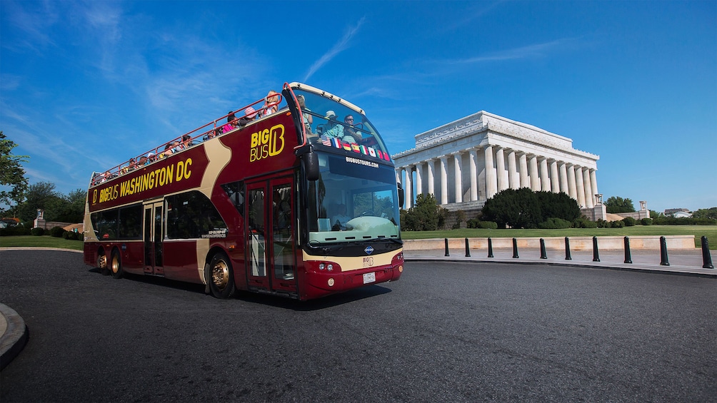 Double decker bus driving past the Lincoln Memorial in Washington DC