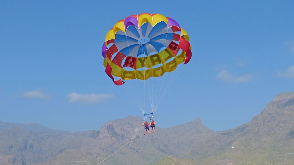 Couple parascending in Spain