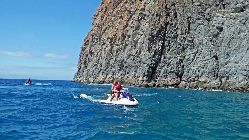 Jet ski along rock formations in Spain