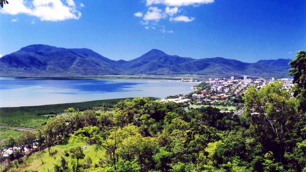 Show item 3 of 8. City along the coast with mountains in the background in Cairns