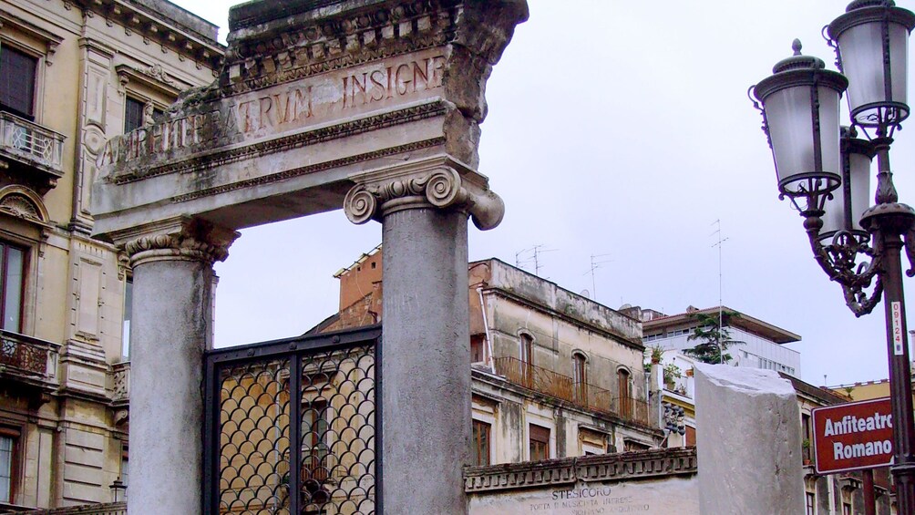Apri foto 3 di 7. Outside the ruins of a roman amphitheater in Catania