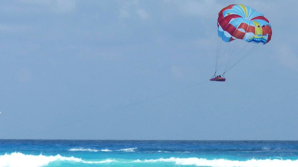 couple parasailing inside a small raft in Florida