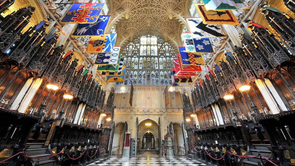 Banners hang from the ceiling in Westminster Abbey in London