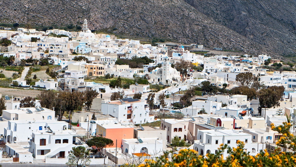 a town of white buildings at Santorini in Greece