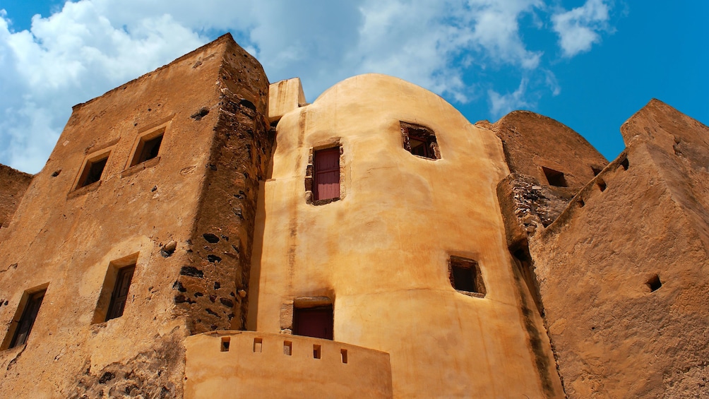 old buildings carved out of stone in Santorini