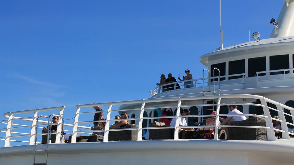 whale watchers on the deck of the cruise in Los Cabos