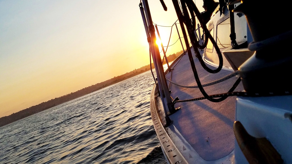 View of sunset from deck of sailboat in San Diego