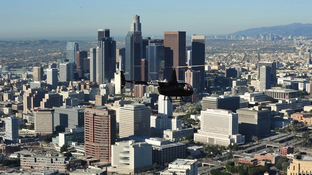 Tour helicopter flying past Los Angeles skyline