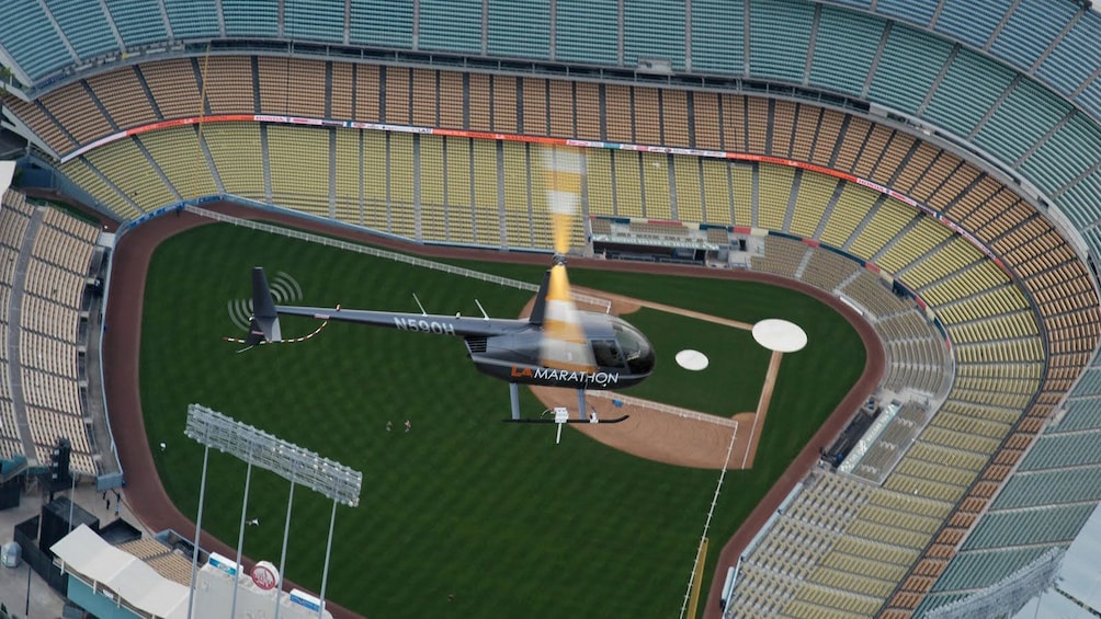 helicopter flying over a baseball stadium in Los Angeles